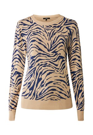 Beige sweater med marineblå tigerstribe mønster, rund halsudskæring, lange ærmer, blød strik tekstur og ribbede manchetter og kant.