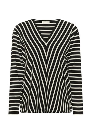 Fekete-fehér csíkos hosszú ujjú felső, elülső részén átlós csíkokkal, ujjain vízszintes csíkokkal, V-nyakú gallérral.