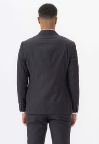 Mørkegrå jakkesætjakke med en glat tekstur, slim fit-design og hakkede revers. Har to knapper og en enkelt ventil på ryggen.