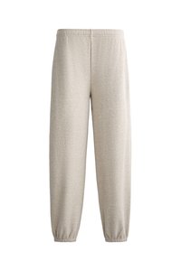 Lichtgrijze sweatpants van zacht materiaal, met een elastische tailleband en aansluitende boorden, in een relaxte, taps toelopende stijl.