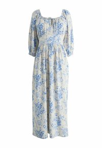 Šviesiai smėlio spalvos maksi suknelė su mėlynu gėlių raštu, pūstomis trimis ketvirčiais rankovėmis, su sukaupta juosmens dalimi ir kaklo raišteliu.