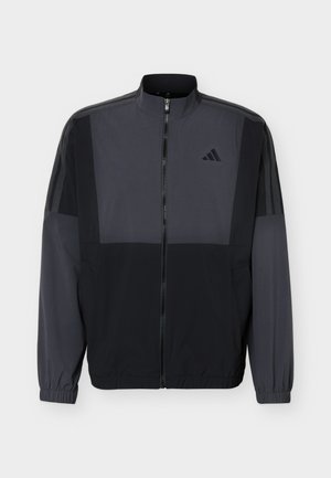 Meeste musta ja tumedat halli värvi lukkudega spordijakk kõrge krae, elastsete varrukate ja õrna Adidas logo rinnal.