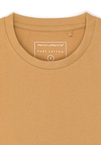 Musztardowa bawełniana koszulka z okrągłym dekoltem, z metką "PAKO LORENTE PURE COTTON", rozmiar S. Gładka faktura.