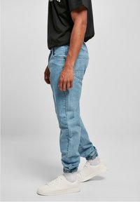 Southpole SPRAY  - Sirgete säärtega teksad - midblue washed