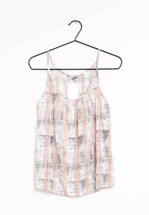 Blouse femme sans manches avec fines bretelles, présentant un motif rayé vertical blanc, orange et gris, suspendue à un cintre noir.