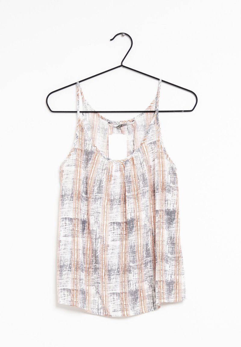 Blouse femme sans manches avec fines bretelles, présentant un motif rayé vertical blanc, orange et gris, suspendue à un cintre noir.