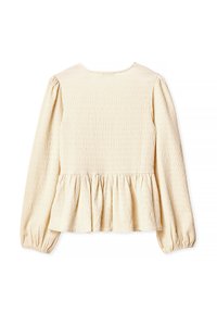 Light cream blouse with long puff sleeves, textured smocked fabric, and a peplum hem, featuring a round neckline and gathered detailing.