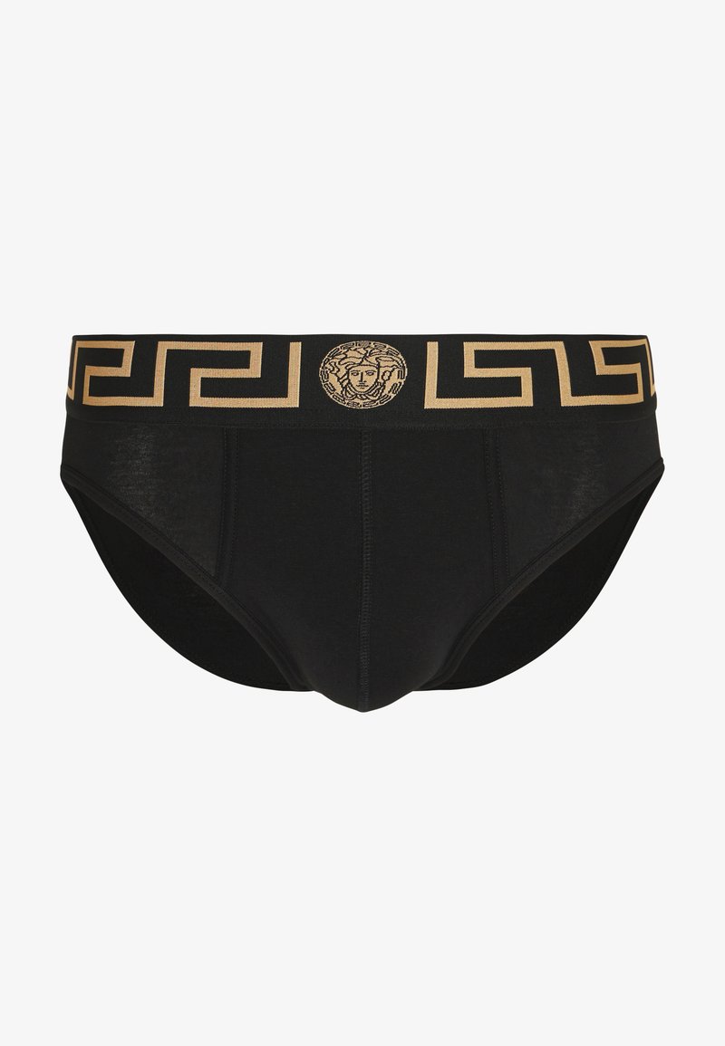 Black cotton briefs with a gold geometric patterned waistband featuring a central Medusa emblem. Seamless design with straight cut.