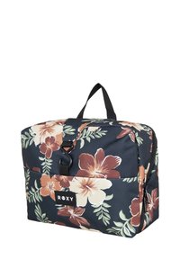 Black floral pattern bag with large beige and orange flowers, a top handle, zipper closure, and a front pocket with a logo tag.