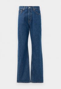 Μπλε τζιν παντελόνι καμπάνα με ψηλή μέση, διαθέτει πέντε τσέπες, κλείσιμο με ασημένιο κουμπί και εμφανή ραφές.