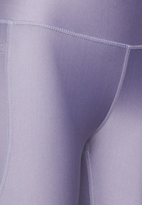 Under Armour TECH - Leggings - purple