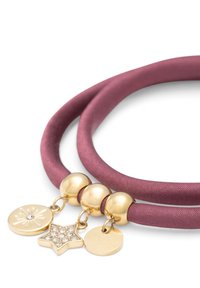 Purple satin necklace with three gold beads and three charms: a sunburst, a star with rhinestones, and a circular tag.
