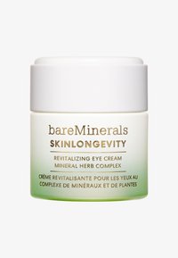 Vit jar med en slät yta, gradient grön botten, guldtext. Texten anger att det är en revitaliserande ögonkräm med en mineral- och örtkomplex.