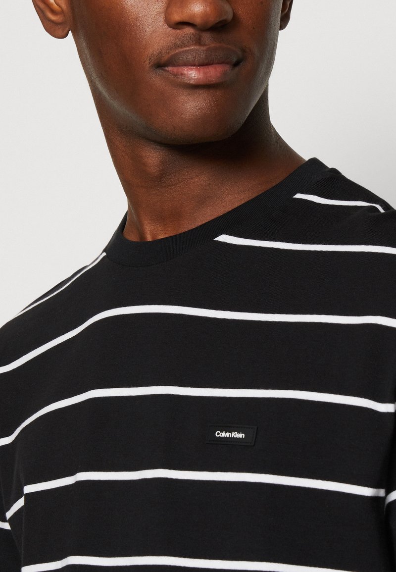 calvin klein black and white striped shirt