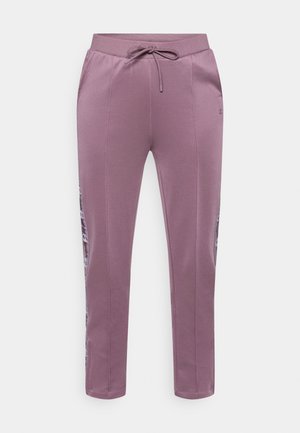 Joggers deportivos morados con cintura ajustable, detalles en panel lateral y pierna ajustada. Hechos de tela suave y elástica para mayor comodidad.