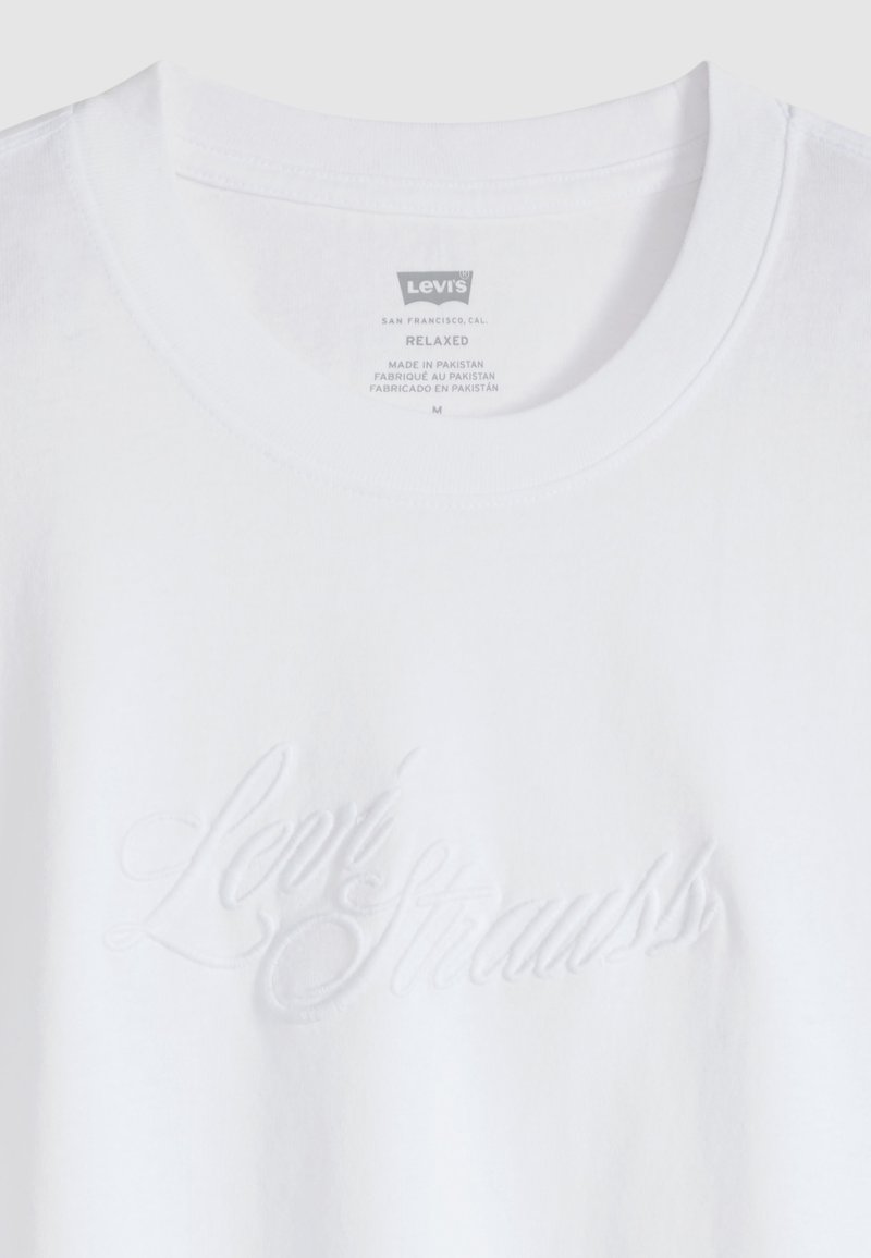 White Levi's relaxed fit t-shirt with embossed Levi Strauss script on front and printed size and origin label inside the collar.