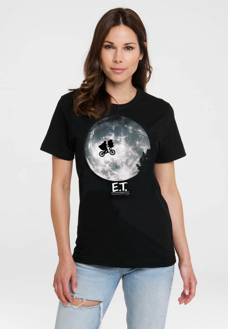 Black T-shirt featuring a large graphic of a full moon with a silhouette of a boy on a bicycle and an alien, labeled "E.T." at the bottom.