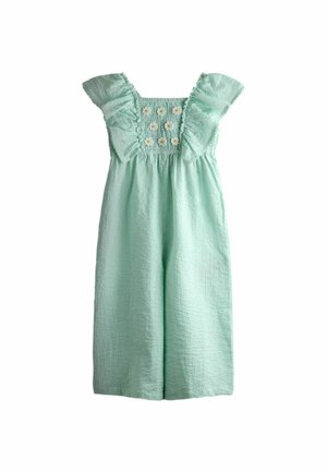 Svetlozelený textúrovaný overal s riasenými krátkymi rukávmi a vyšívanými bielymi margarétkami na nariasenej hornej časti.