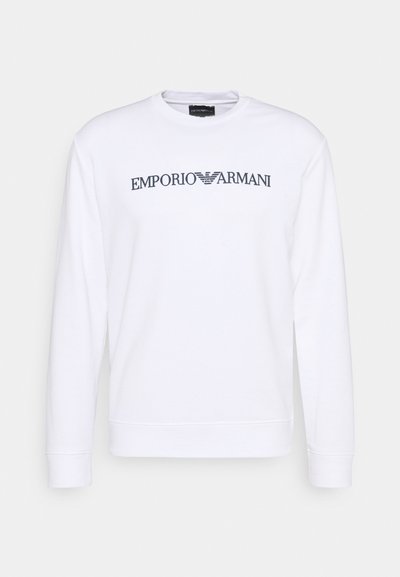 Biele dlhé rukávy mikina vyrobená z mäkkej textílie, s logom "Emporio Armani" v tmavošedej farbe naprieč hrudníkom. Jednoduchý dizajn, okrúhly výstrih.