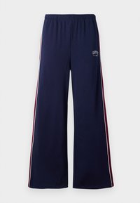 Marinblå vida sweatpants med elastisk midja, vita och vinröda sidostripes, samt liten GAP NYC-logotyp på vänster lår.