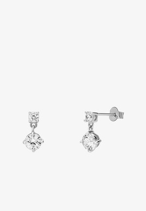 Boucles d'oreilles en argent avec un zircon cubique clair en haut et un plus grand zircon cubique suspendu en dessous, tous deux en sertissage griffes.