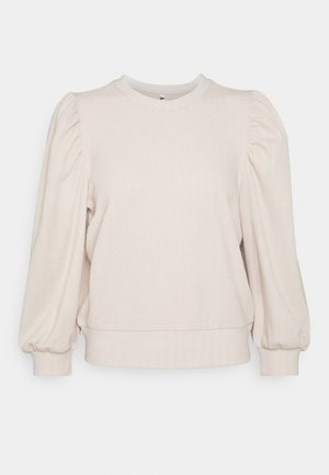 Pull texturé blanc cassé avec manches longues bouffantes, encolure ronde, et poignets et taille ajustés.