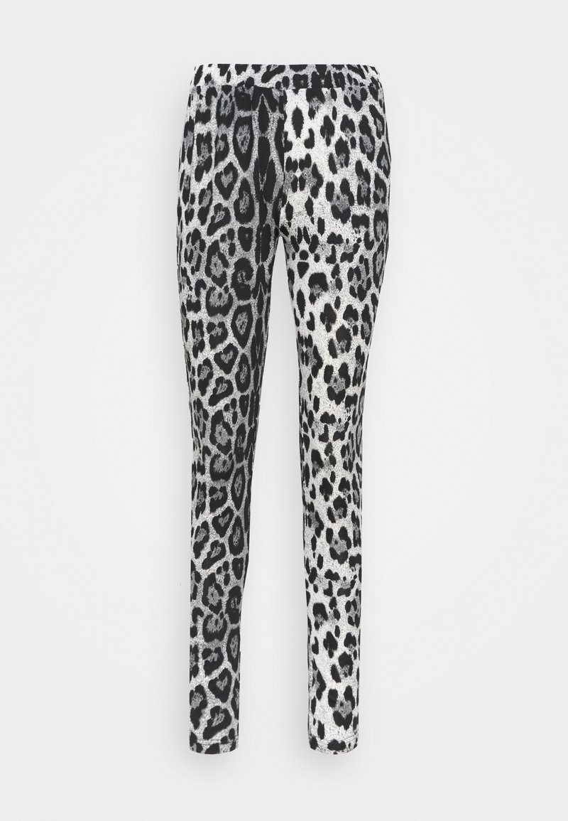 Svarta och silver leggings med ett leopardmönster som har variationer av fläckar och hjärtan, tillverkade av ett mjukt och elastiskt tyg.
