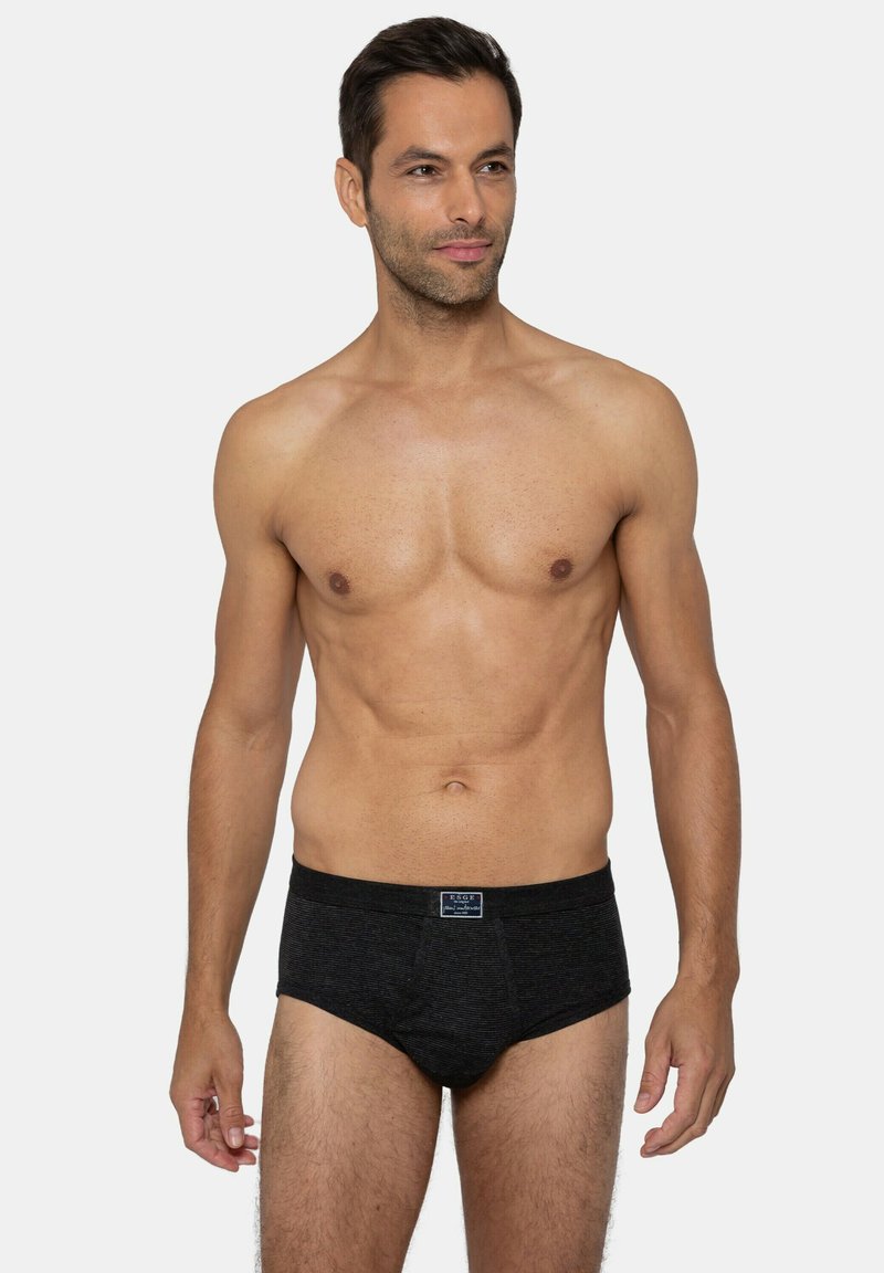 Slip in cotone nero con texture a coste, fascia elastica con etichetta del logo, design attillato e taglio classico.