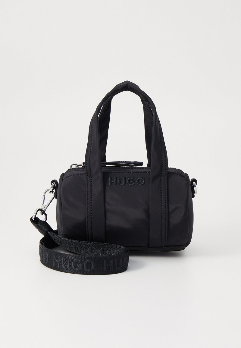Black nylon handbag with dual top handles and adjustable shoulder strap. Features embossed logo and zip closure. Textured surface.