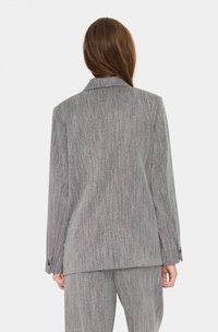 Gray striped blazer with a structured design, single-button closure, and notch lapels. Features two back vents and buttoned cuffs.