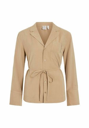 Beežikas pikkade varrukatega nööbitav särk rinnatasku, sälguga krae ja vööga, mis on vöökoha juures seotud.