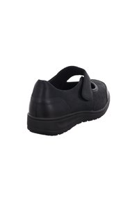 Schwarzer Schuh mit einem Obermaterial aus Stoff, Klettverschluss und runder Zehenpartie. Verfügt über ein strukturiertes Design, eine gepolsterte Sohle und eine hintere Fersenlasche für einfaches Anziehen.