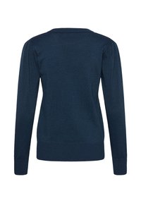 Navy blauwe gebreide trui, met een ronde halslijn, lange mouwen met opgeblazen schouders, en ribgebreide manchetten en zoom. Glad textuur.