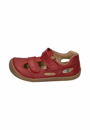 Red leather children’s sandal with double Velcro straps and cut-out details, beige interior lining, and rubber sole.