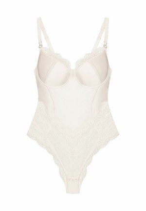 Underwired bodysuit in light beige with lace trim, adjustable straps, and button closures at the crotch. Smooth texture with decorative accents.