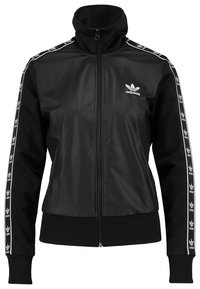 Černá sportovní bunda se zipem vpředu, vysokým límcem a kontrastními bílými pruhy podél rukávů s logem Adidas.