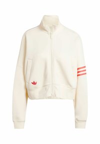 Kort creamfärgad fleecejacka med dragkedja. Har röda tre-randiga detaljer på ärmen och en liten broderad logga på fickan.