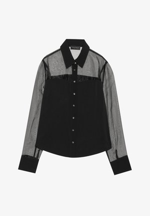 Mustapaita, jossa on kiinteä kangasrunko ja läpinäkyvät pitkähihaiset hihojen. Varusteena kaulus, napitus ja ristiriitaiset tekstuurit.