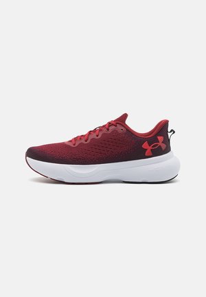 Red and black Under Armour running shoe with mesh upper, white cushioned sole, and logo on heel against white background.