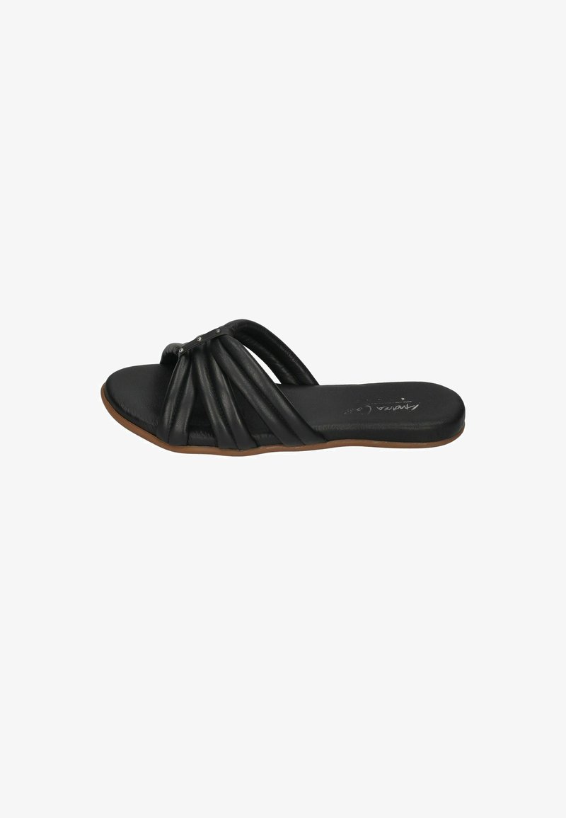 Black leather slide sandals with a flat sole, featuring gathered straps and a metallic accent. Smooth texture and minimalistic design.