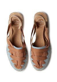 Brown textile and denim espadrille sandals with woven straps, round toe, and braided jute sole. Features a fabric lining and cushioned insole.