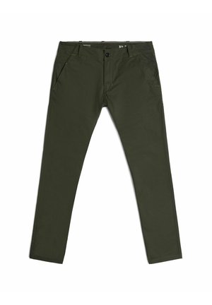 Groene katoenbroek met een slim fit, vijf zakken en gele stikaccenten. Voorzien van een ritssluiting en een knoopsluiting.