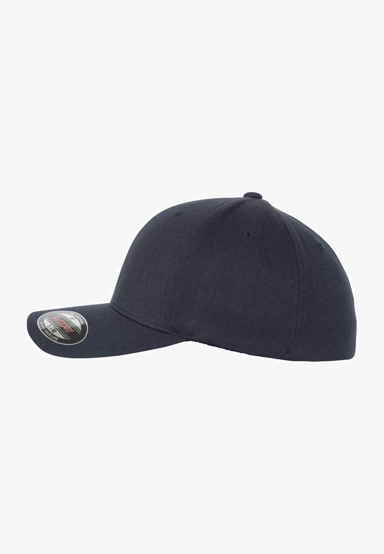 Dark navy baseball cap with a rounded crown, stiff curved brim, fabric texture, and a circular logo sticker on the front.