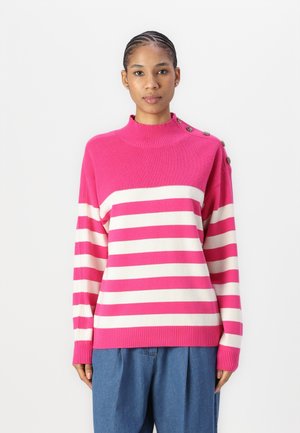 Pink and cream striped sweater with a high ribbed neckline, featuring button accents on the shoulder and ribbed cuffs, made from soft material.