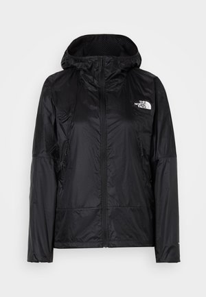 Čierna mikina na zips s kapucňou, dlhými rukávmi, bočnými vreckami a bielym logom "The North Face" na hrudi.