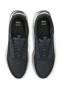 Dark blue athletic shoes with mesh and synthetic upper. Textured design, lace closure, cushioned sole, and logo on the insole.