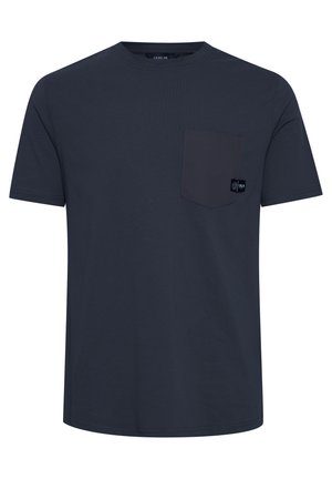 T-shirt a maniche corte blu navy in cotone, con tasca sul petto e un piccolo etichetta del marchio. Tessuto morbido, scollatura rotonda.