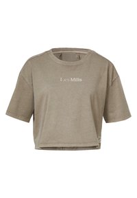 Beige zkrácený tričko vyrobené z jemné bavlny, s krátkými rukávy, kulatým výstřihem a nápisem "Les Mills" vytištěným ve světlé barvě na přední straně.