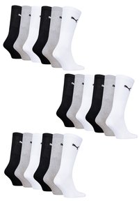 12er-Pack Socken in Schwarz, Weiß und Grau. Material aus Baumwollmischung, gerippte Gestaltung, mit kleinem Puma-Logo auf jeder Socke.