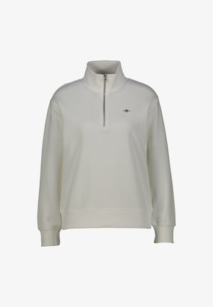 Felpa bianca con zip a un quarto. Tessuto morbido e liscio con maniche lunghe e polsini a costine. Presenta un piccolo logo sul lato sinistro del petto.